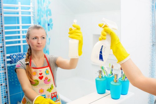 Professional cleaner in Westkensington preparing a tidy living room