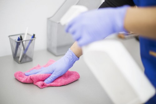 Professional office cleaners working in a Westkensington business space
