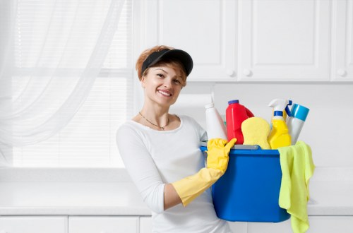 Supervisor and cleaner assessing a workplace hazard before continuing