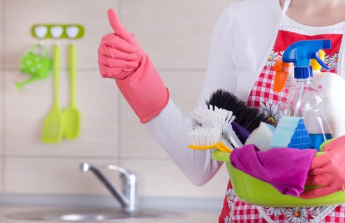 Domestic cleaner tidying a family home in Westkensington